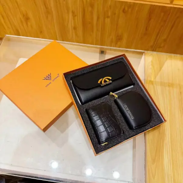 Minimalist luxury black leather accessory combo gift set, contains soft leather glasses case, textured croc card holder and mini leather pouch, matched premium orange outer box, thoughtful high-end gift for gentlemen