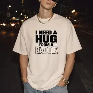 I Need A Hug From A Baddie Shirt, Funny Graphic Tee for Men Women, Trendy Y2K Streetwear, Edgy Slogan T-Shirt, Oversized Aesthetic Top, Humorous Gag Gift, Vintage Style Cotton Apparel, Unisex Clothing