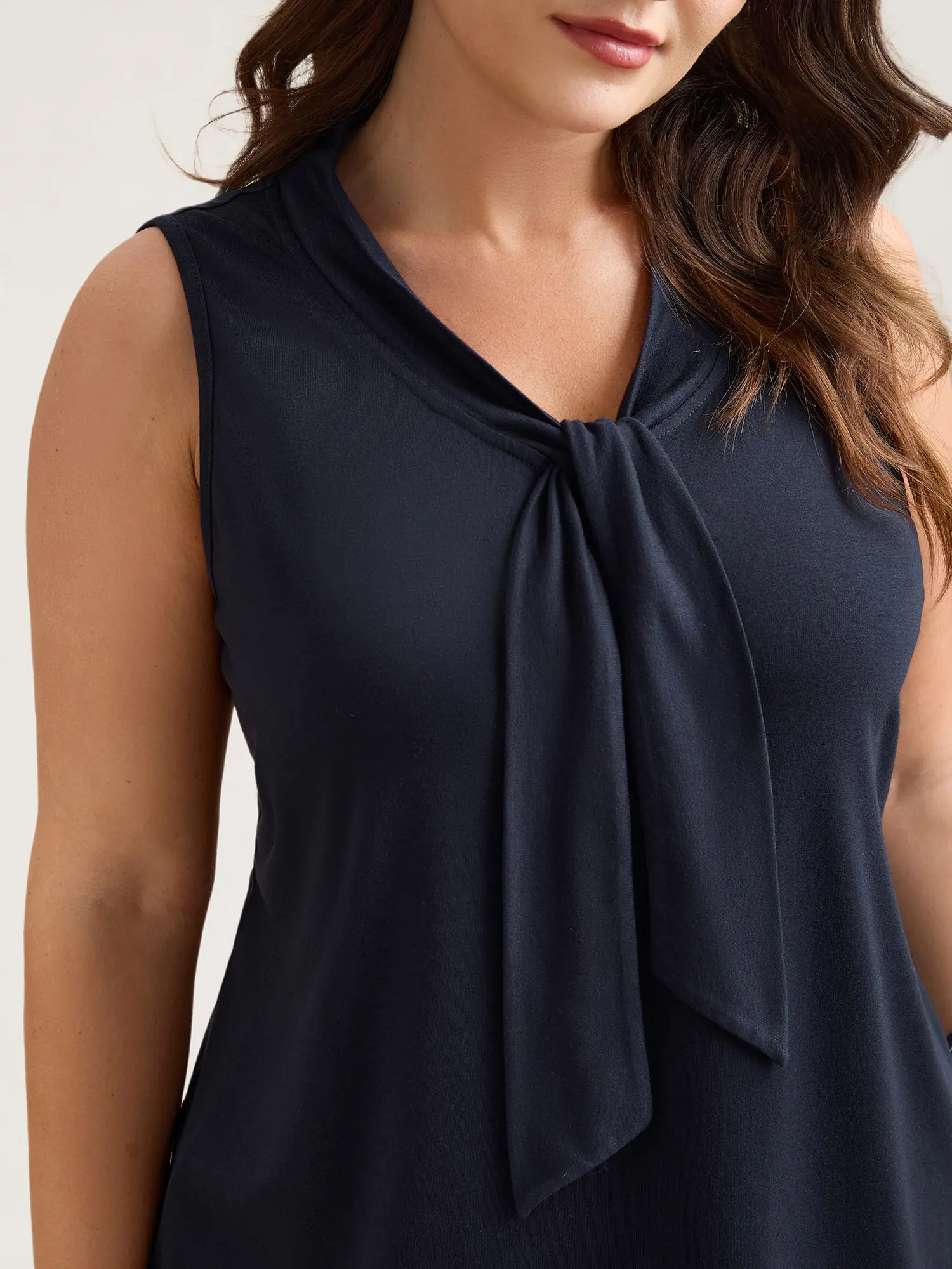 BloomChic Women's Plus Size Tie-Neck Sleeveless Blouse - Solid Indigo Minimalist Style Garment, Regular Fit Spring Top for Business Office, Low-Iron Spandex Fabric with Great Fit, Ribbon Tie, Plain, Low Ironing, Spandex Blend, Lady, Blouses Shirts Tops, B