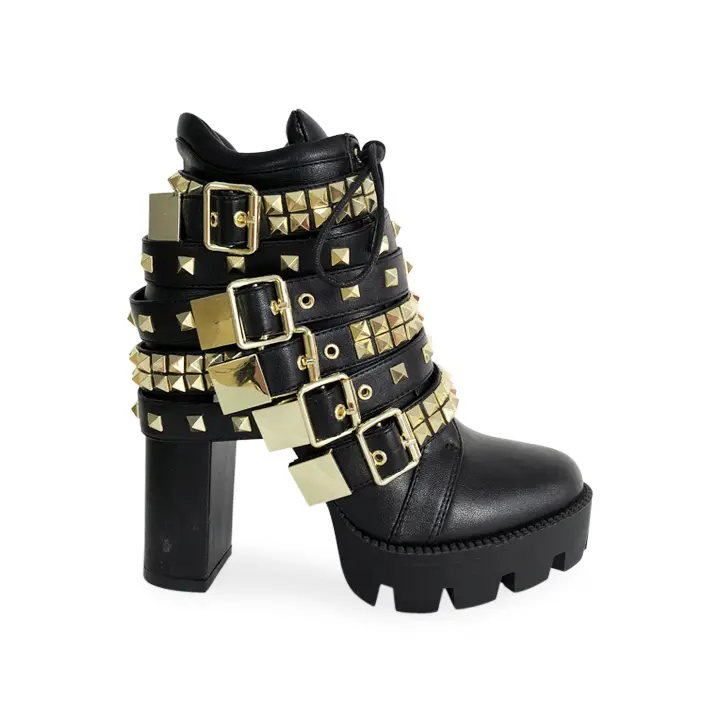 Black platform boots with gold studs, and ornaments Black platform boots with gold studs, and ornaments