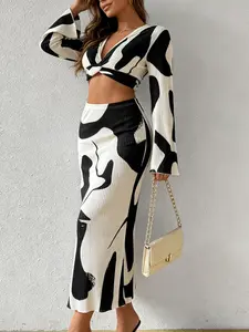 Two piece set of fashionable European and American style spicy girl with cow pattern, twisted V-neck long sleeved top+high waisted skirt, suitable for all seasons, suitable for home, indoor, and outdoor wear
