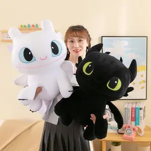 Funny toothless stuffed animal in bed with a large doll to give a girl a birthday gift Valentine's Day cosplay doll
