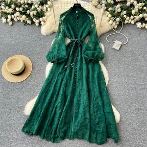 This long dress with an elegant European and American style stand-up collar, single-breasted buttons, heavy hook flower embroidery, lantern sleeves, tie straps, cinched waist and large hem