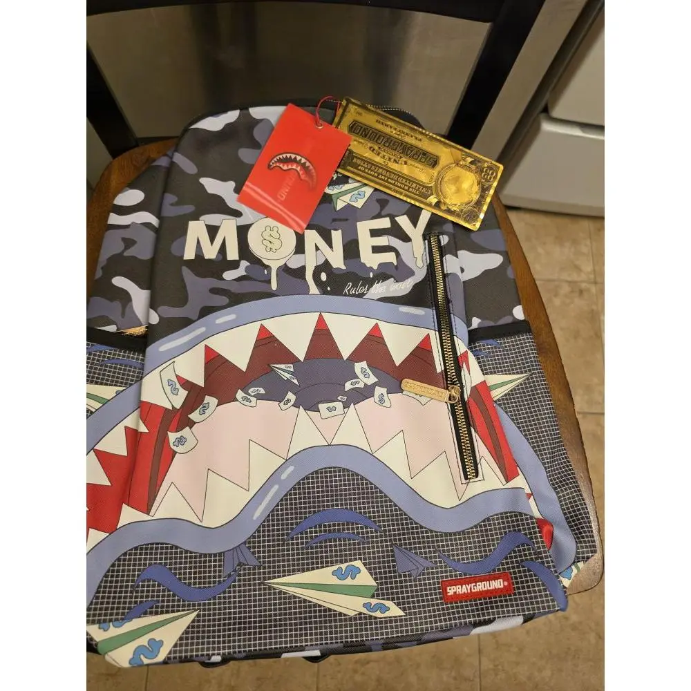 Sprayground Money Camo Backpack with Shark Design and Gold Tag