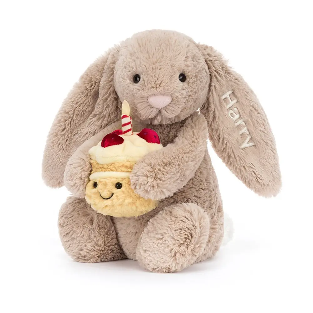 Jellycat plush bunny hugging a Beige Bunny Birthday cake