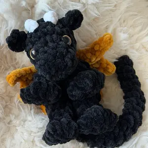 Crocheted Black Onyx Storm inspired baby dragon
