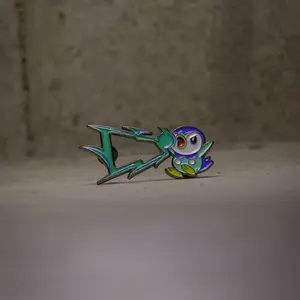 Piplup Fitted Pin - Green and Purple Design as Show in the Image