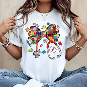Cute Bow Print T Shirt With Colorful Puzzle And Medical Elements Design Perfect For Casual And Sporty Outfits