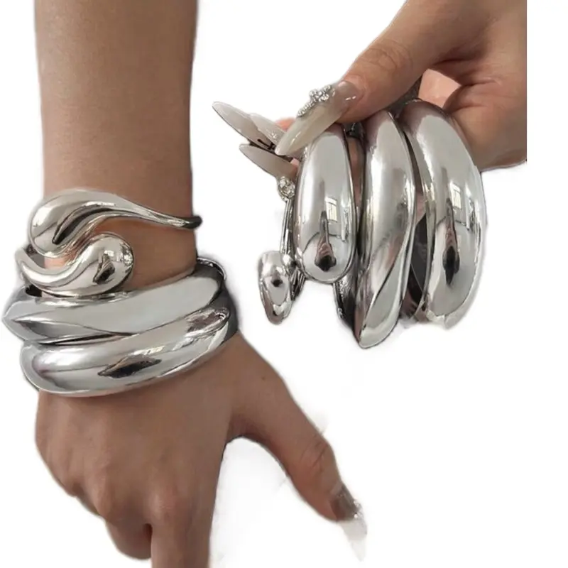 Luxury Gold Bangle Set   Make a bold statement with this stunning Luxury Gold Bangle Set. Designed with a fashionable oversized look, these wide, thick bangles add instant elegance and confidence to any outfit. Perfect for dressing up your everyday sty