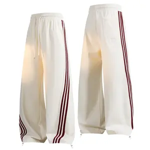 Fashion Side Stripe Wide Leg Sports Pants Unisex Couple Drawstring Tie Feet Casual Sweatpants with Red Stripes in Polyester Trouser Striped Man Personalized