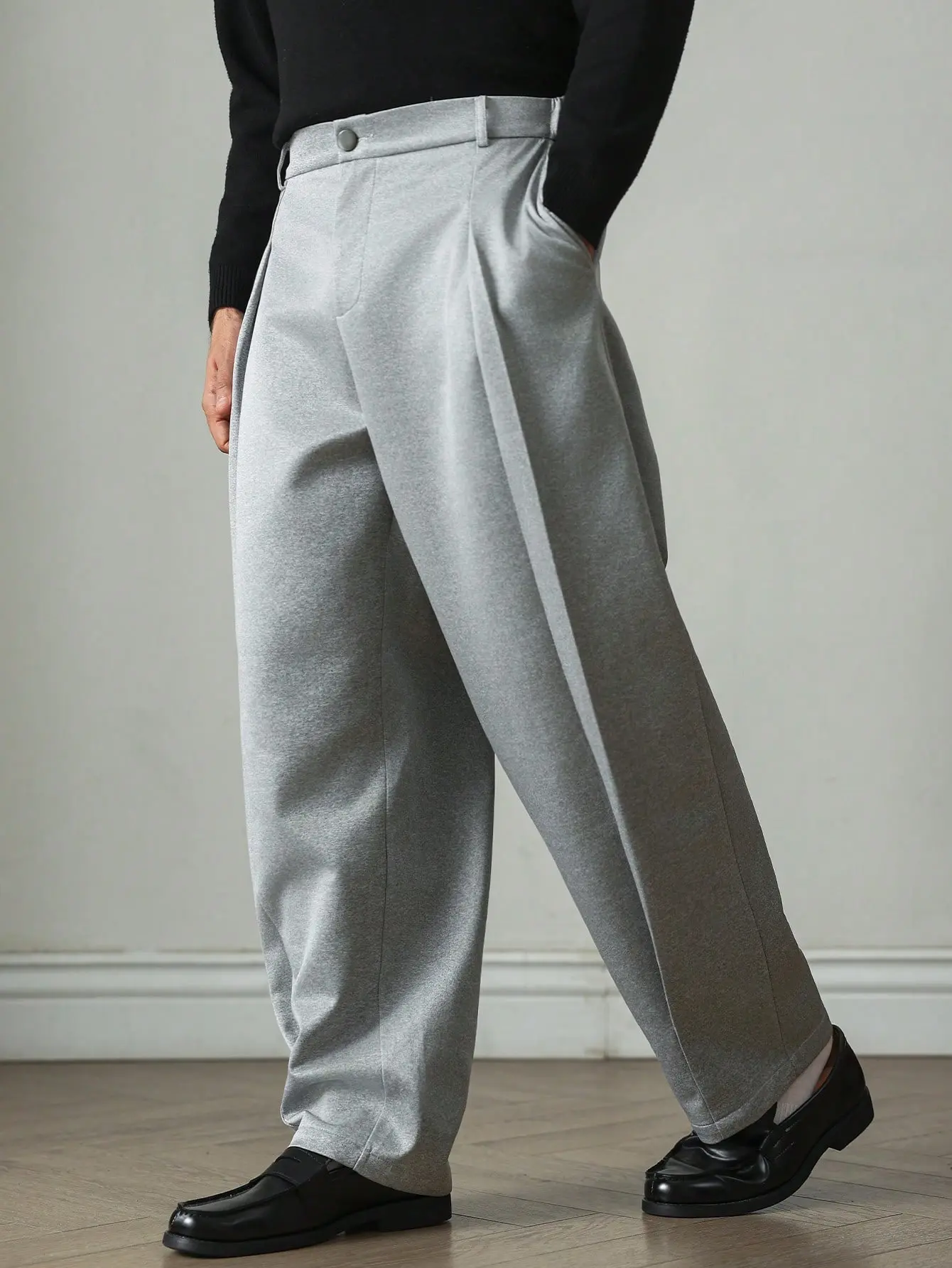 Men’s Gray Single Pleat Knit Wide Leg Dress Pants – Soft, cozy knit fabric, front accordion pleat detail, button and zipper closure, elastic waistband at back, relaxed straight leg with a drapey silhouette, American Cleanfit commute pants for fall/winter