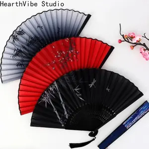 2026 Stylish vintage bamboo folding fan with tassel - Portable handheld summer fan, perfect for celebrations, events, and gifts.  Features a solid color design with floral details.  Event accessory | Decorative fan | Easy-to-carry fan