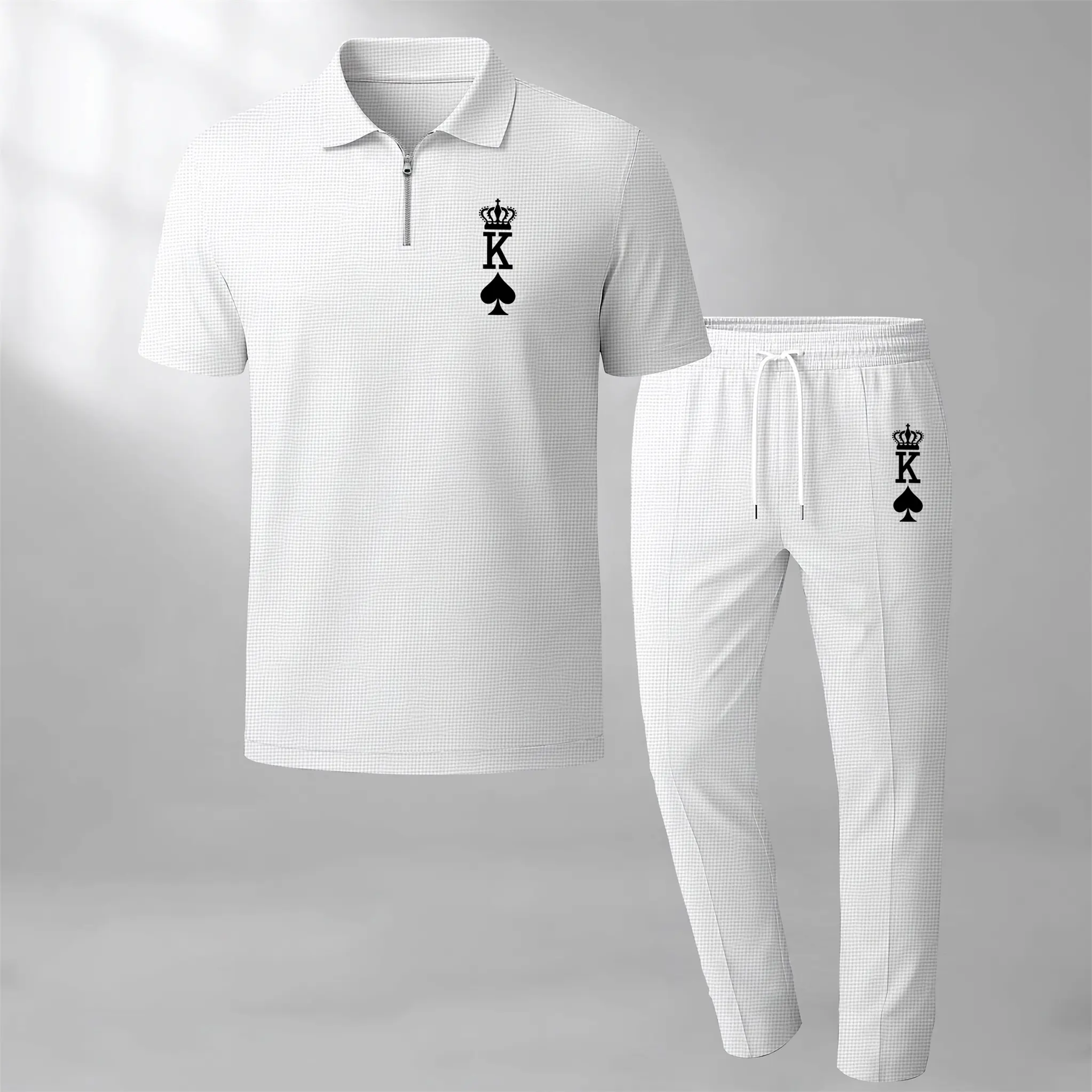 Stay stylish this summer with our Men's King print two-piece set, featuring a zippered polo shirt and drawstring trousers!