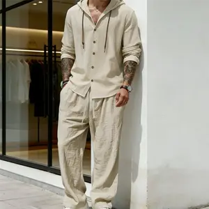 Men’s solid-color linen set for a casual, fashionable coordinated look—breathable, quick-drying top paired with drawstring wide-leg pants, ideal for beach vacations; summer menswear collection. Beige Clothes