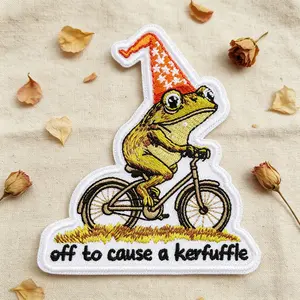 Off to Cause a Kerfuffle Embroidered Patch, Fun Frog Riding Bike Embroidery Design Fabric Patch, Heat Transfer Adhesive, for Clothes Jackets Hats Accessories