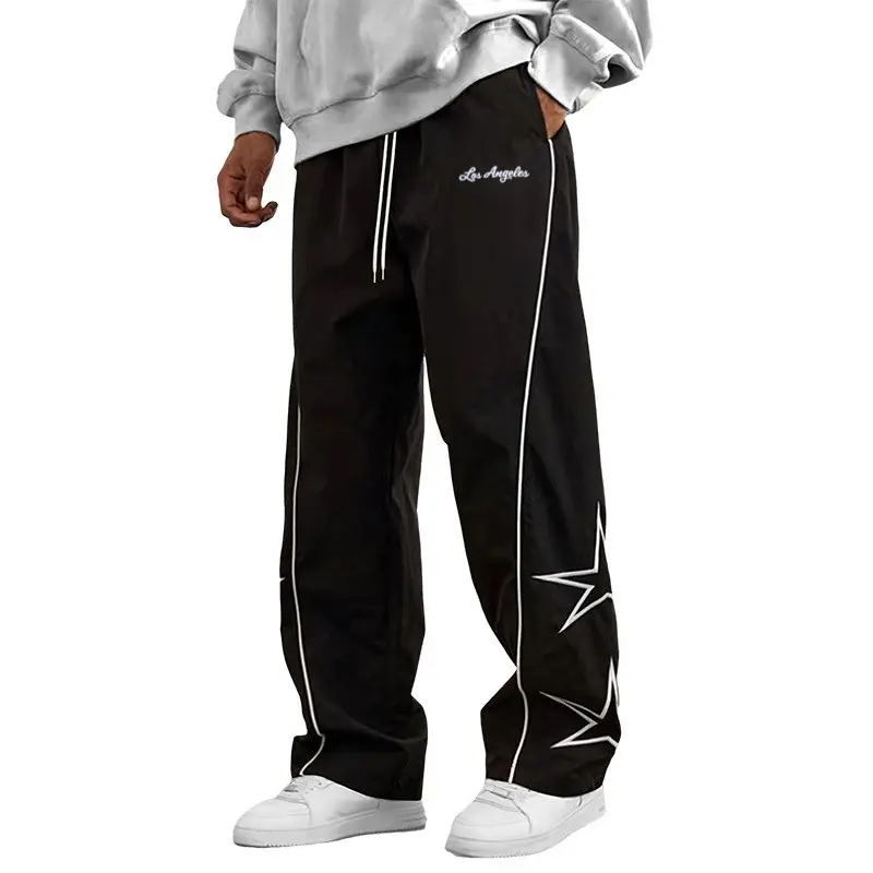 Men’s star graphic print track pants with elastic drawstring waist and side piping, loose wide-leg streetwear windbreaker pants