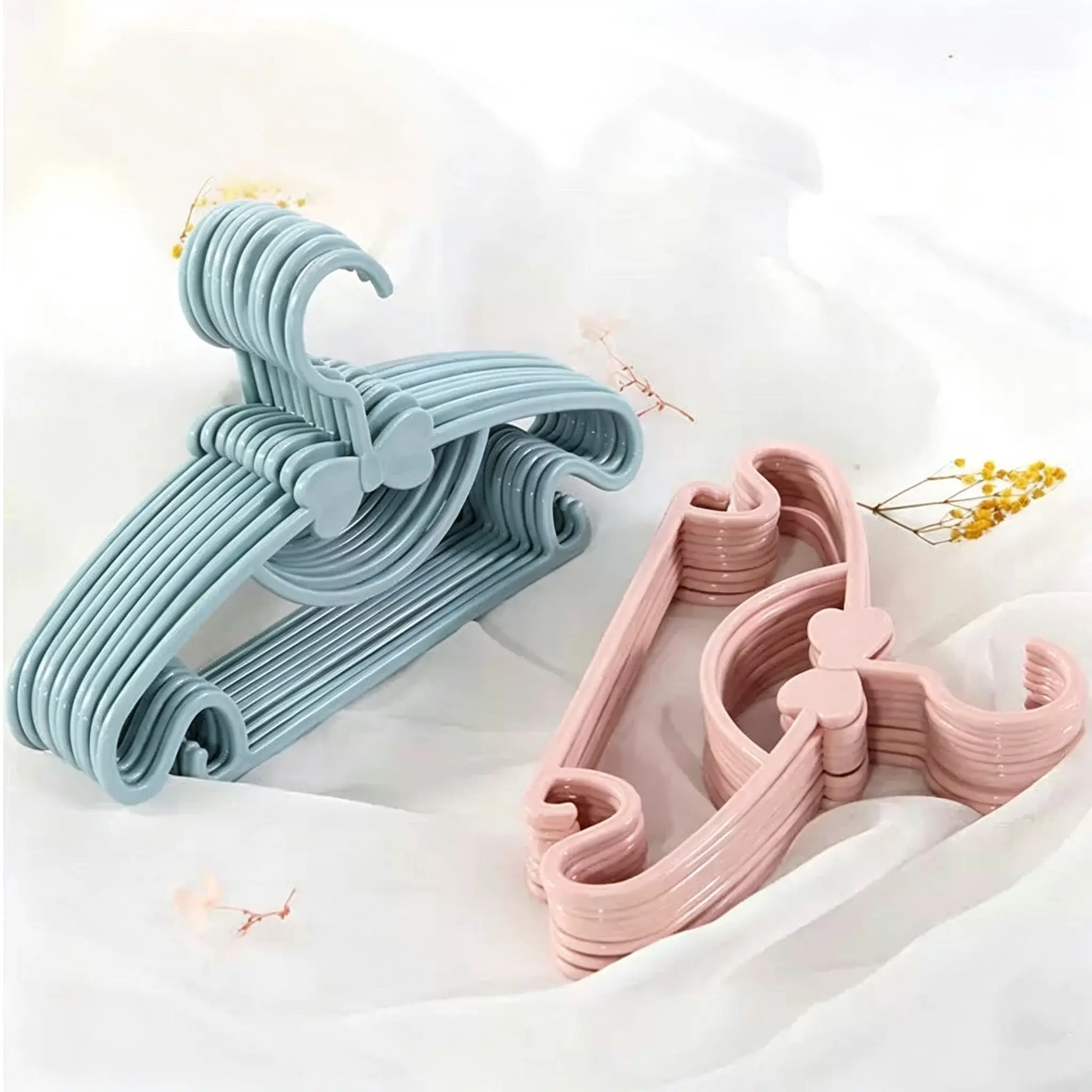 10 Piece Colorful Plastic Hangers for Kids, Cute Bow Design with Clips, Durable Wet/dry Hangers for Closet Organization, Fashionable Child Hangers, Hanger Pack