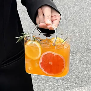 1pc 700ml large-capacity tote-style glass cup, Funny glass cup, with handle and straw is a juice cup. Made of high borosilicate glass, it's reusable. Suitable for storing juices, iced drinks, milk tea, and coffee. A unique outdoor and kitch