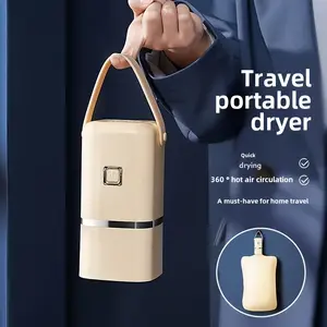 Portable mini dryer with timer function. Fast, easy-to-use compact dryer with drying bag. Suitable for delicate clothes, underwear, small items, and household essentials.