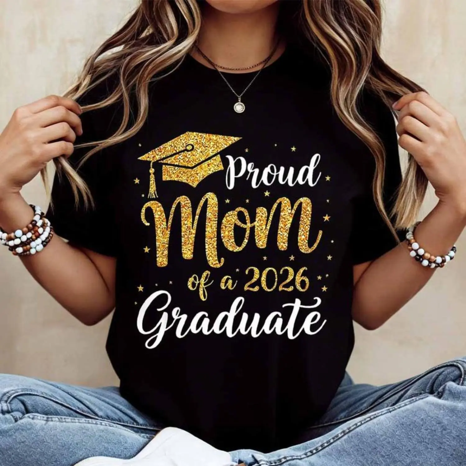 Proud Mother's Celebration T Shirt For 2026 Graduate Featuring Gold Cap And Text Design