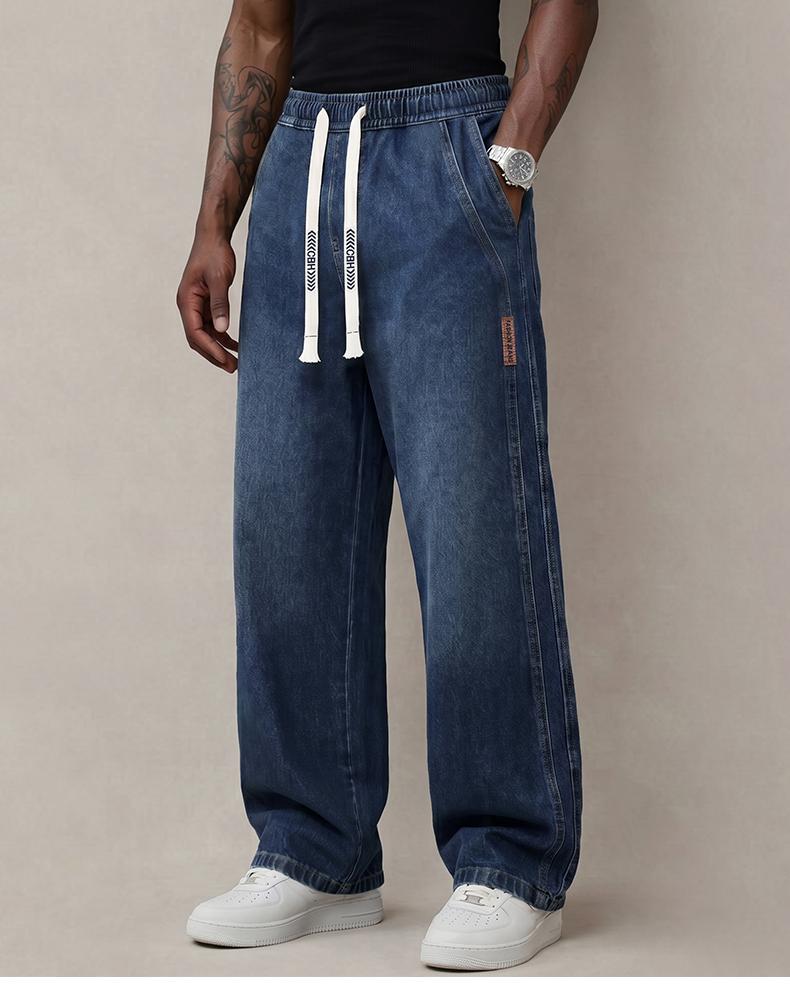 Men’s jeans made from stretchy cotton—comfortable and stylish. Loose fit for everyday wear; long pants with a drawstring elastic waistband design for men.
