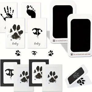 Pet Paw Print Kit, including 2 ink pads, 4 sheets of photo paper, and 4 paper picture frames, perfect for capturing baby footprints and handprints for Halloween, Thanksgiving, and Christmas gifts.