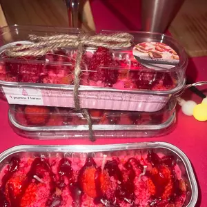 Strawberry shortcake cake candle in a tin pan, please note this will come In a red tin the pink tin is currently sold out. artisan candles