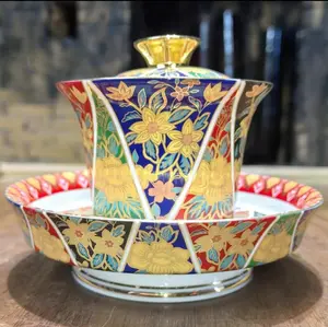 Enamel Gold Inlaid Gaiwan withSaucerTraditional Ceramic Tea BowlSet Featuringvibrant Floral Designand Elegant GoldAccents