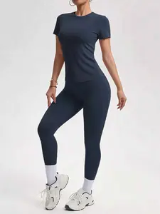 2-piece set - Solid color round-neck T-shirt short sleeves + Women's high-waisted slim-fit athletic pants for a tight and curvaceous silhouette. A comfortable outfit suitable for daily home wear.