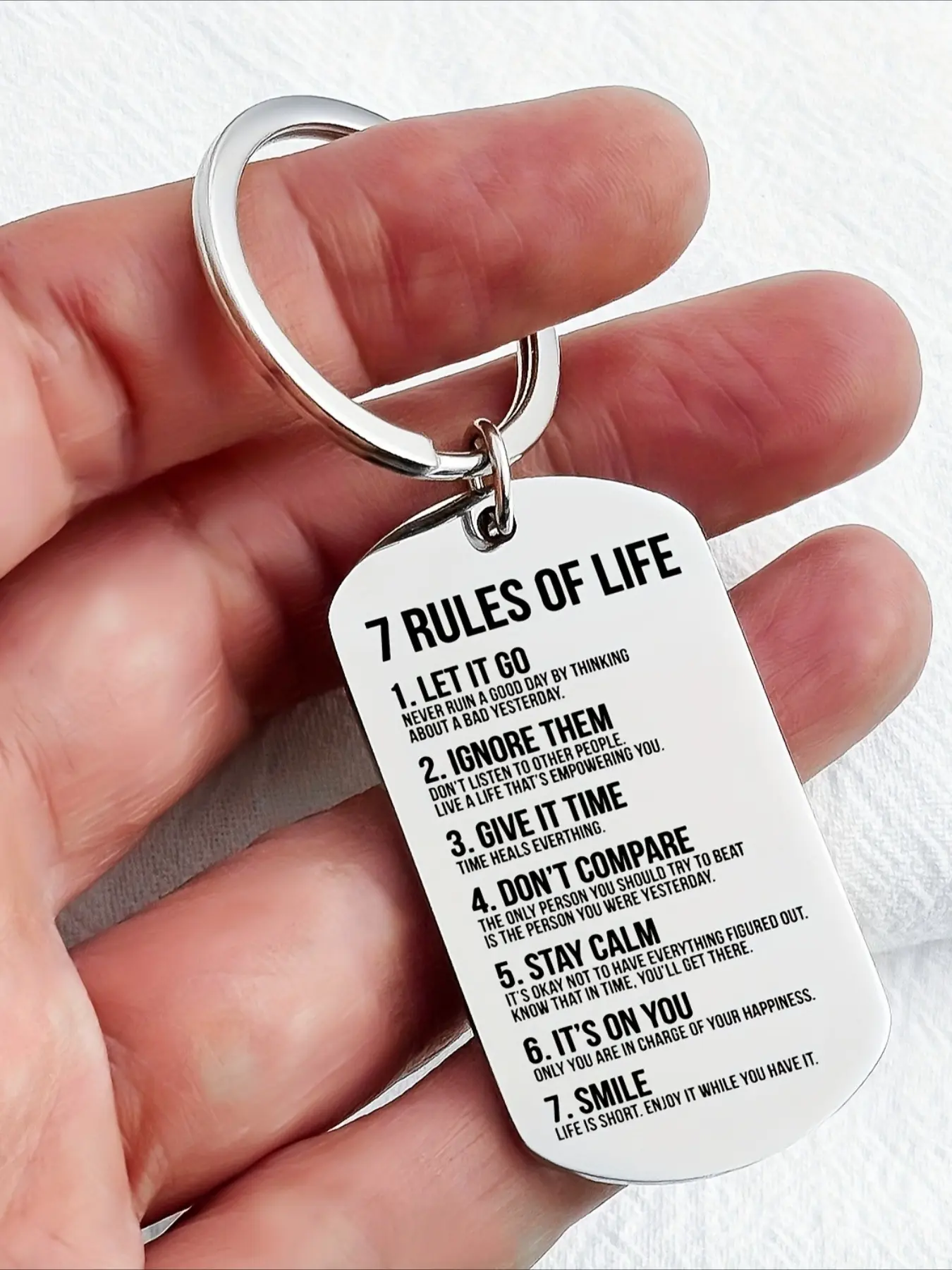 1 piece of stainless steel dog tag keychain, on which is engraved the inspirational motto "7 Rules of Life". It reminds oneself every day to follow the rules on it to become an excellent self. Double engraved tag Metal Keychains