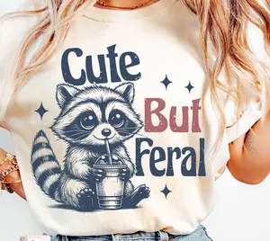 Cute But Feral Tshirt, Funny And Sarcastic Snarky Shirt, Funny Raccoon, Adult Humor, Funny Sarcastic Quote Tee, Unisex T-Shirt, Gifts For Men Women, Short Sleeve Tee Shirt, Gifts For Birthday Fathers Day Christmas Anniversary Thanksgiving
