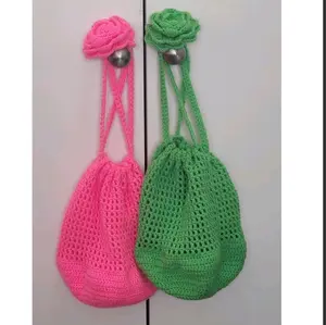 The Rasta Granny's Corsage Tote - Handmade Crochet Drawstring Bag with Rose Design