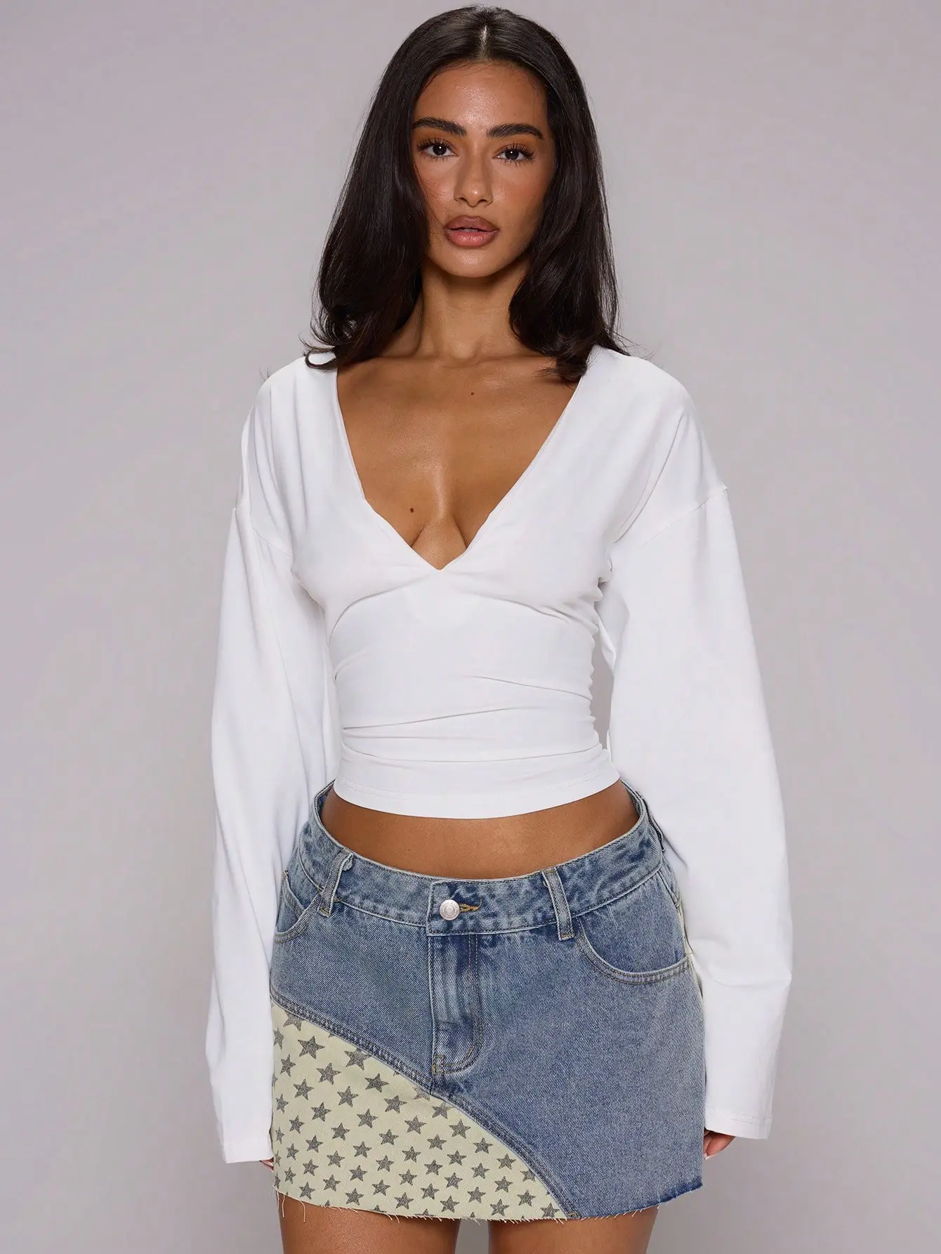 VYNCE White Slinky Deep Plunge Front Cinched Fitted Waist Flowy Batwing Long Sleeve Top