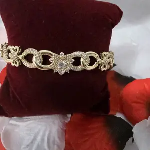 Manilla con sirconia oro laminado de 14k