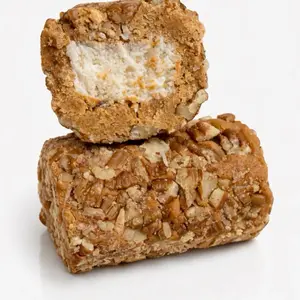 Suchicocada Dulce de leche roll, filled with coconut, with a walnut topping