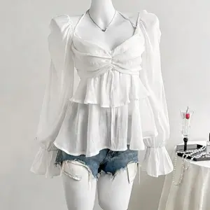 Elegant French-style sheer fabric blouse with ribbon ties and ruffled long sleeves for women, featuring ruffles, asymmetrical design, knotted detail, solid color, bell sleeves, suitable for spring, summer, and autumn