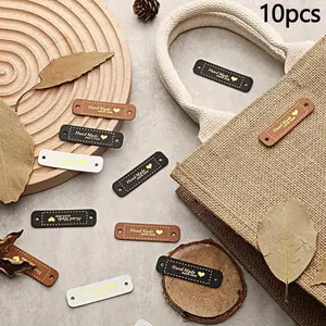 10pcs Handmade PU Leather Tags Handmade with Love PU Labels Faux Leather Sew On Labels Embellishment Knit Accessories with Holes for DIY Crafts Sewing Crochet Knitting Hats (Brown, Black, White)