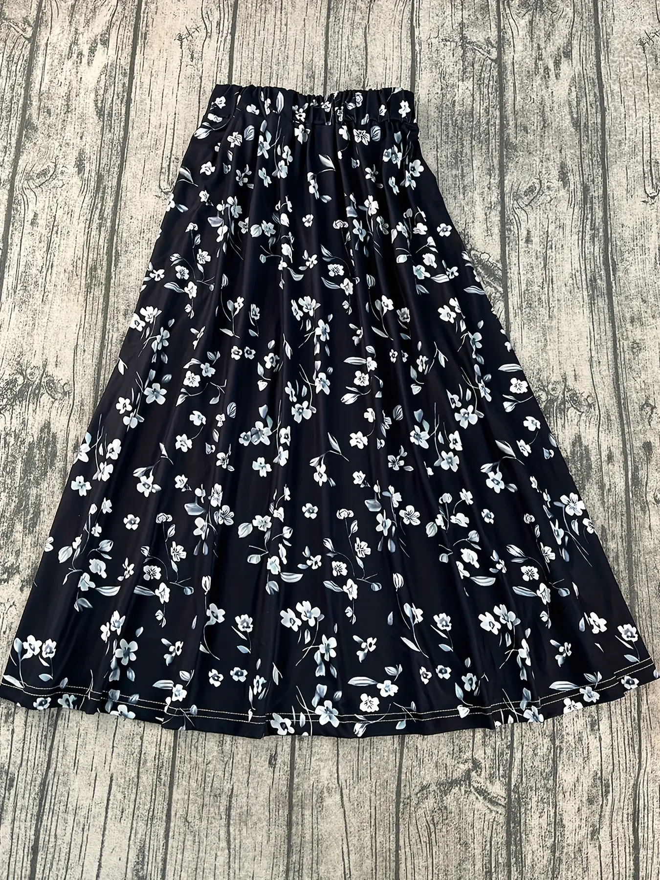 Black background with blue and white floral prints, high-waisted, stretched-waist, wide-swing A-line skirt, spring and summer flowing and slimming mid-length skirt, Boho Casual Skirts