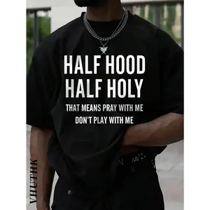 A T - Shirt Featuring The Phrase "HALF HOOD HALF HOLY THAT MEANS PRAY WITH ME DON'T PLAY WITH ME", Showcasing A Bold Personal Statement