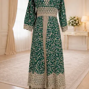 This image shows a green designer heavy embroidered bridal lehenga or Anarkali suit suited for traditional Indian weddings. Womenswear