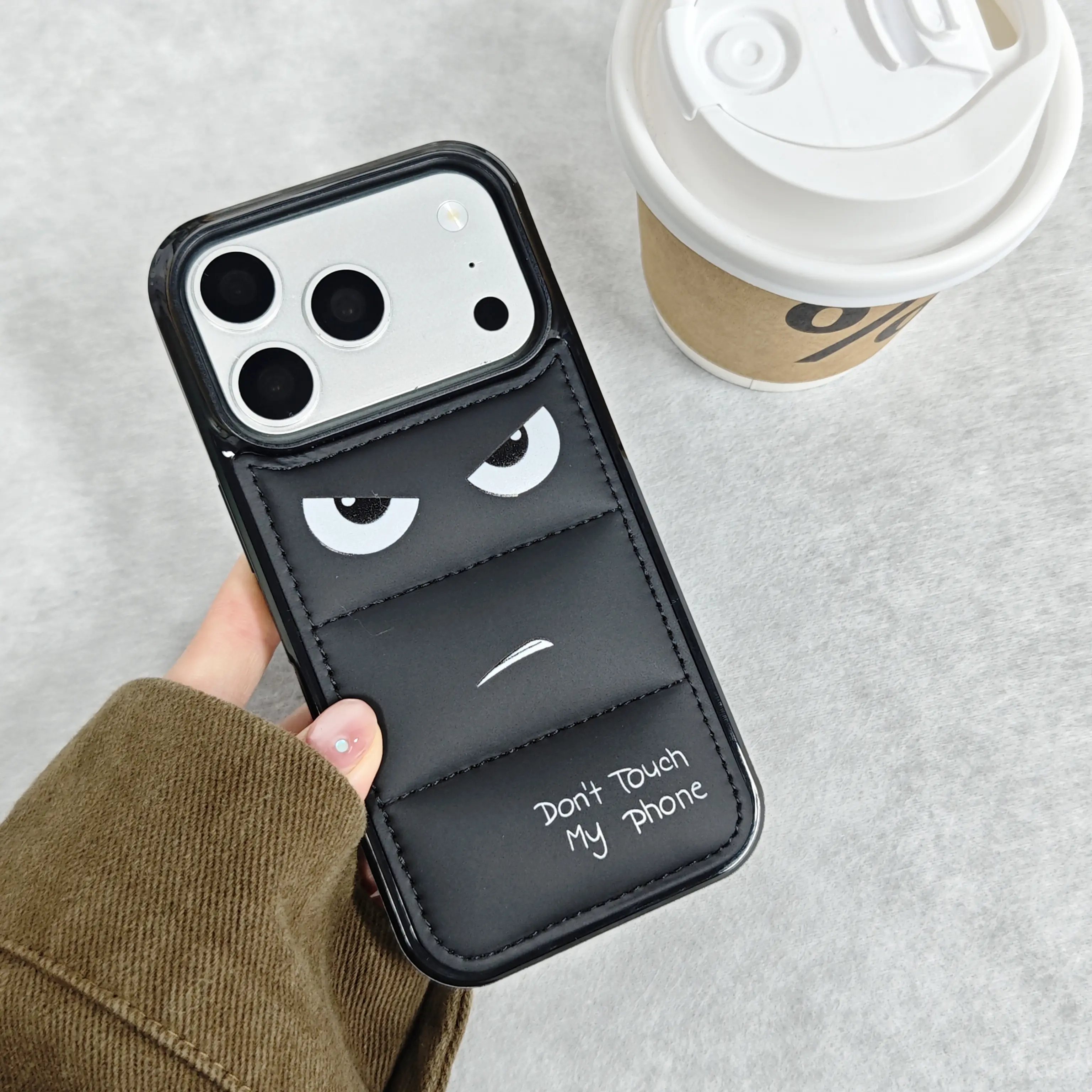 Angry Face Puffer Aesthetic Cellphone Case - Black Down Jacket Style, Trendy Quirky Cute Cartoon, Soft Padding, Full-Wrap Shockproof Protector Casing for iPhone 13-17 Pro Max, iPhone Series Accessory