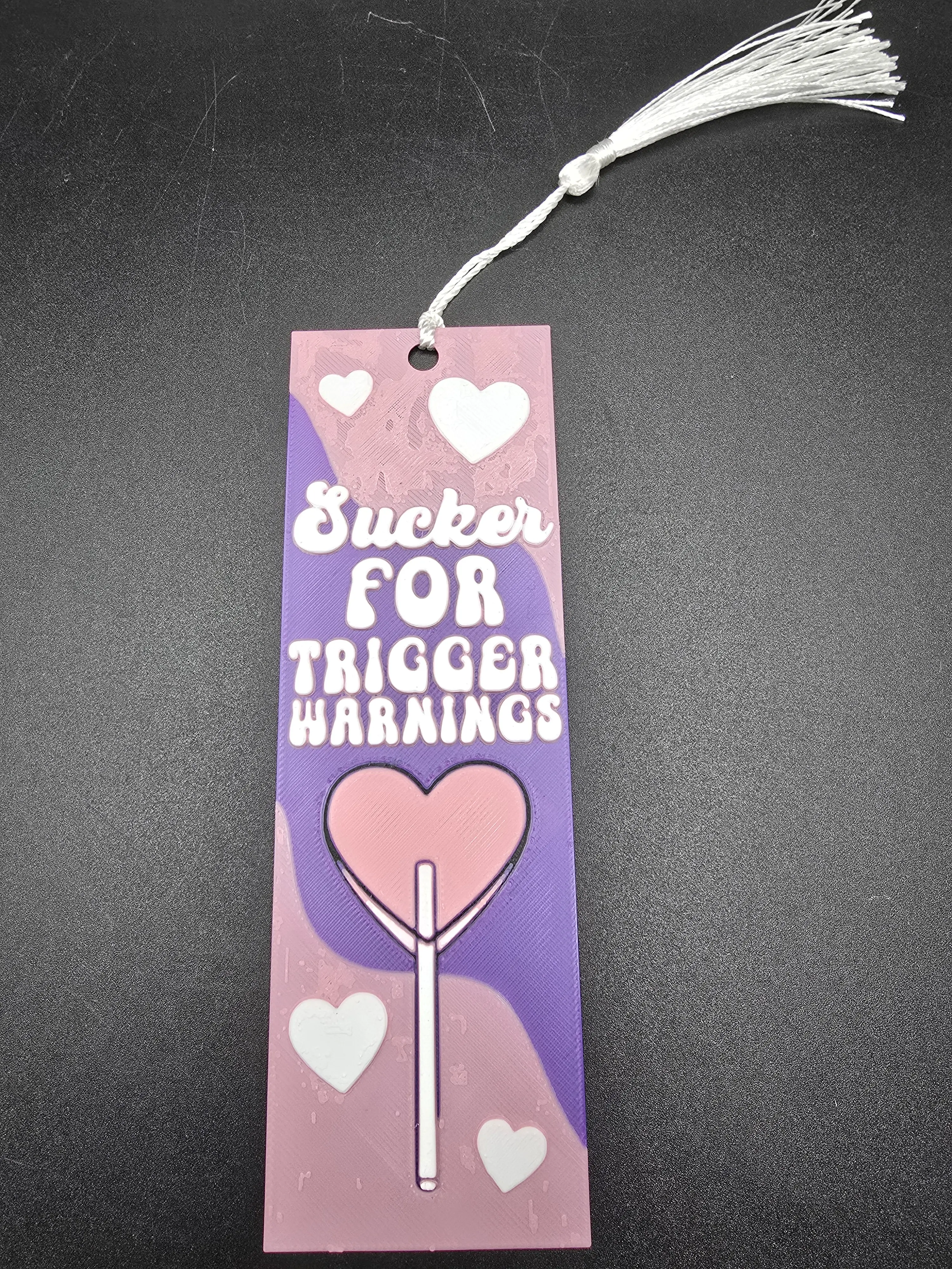 Sucker For Trigger Warnings Bookmark with Heart Design and Tassel Purple and Pink Color Scheme Durable Material for Book Lovers