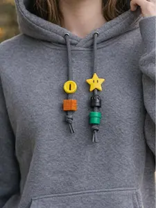 String Squad –  Retro Game-Inspired Hoodie String Charms