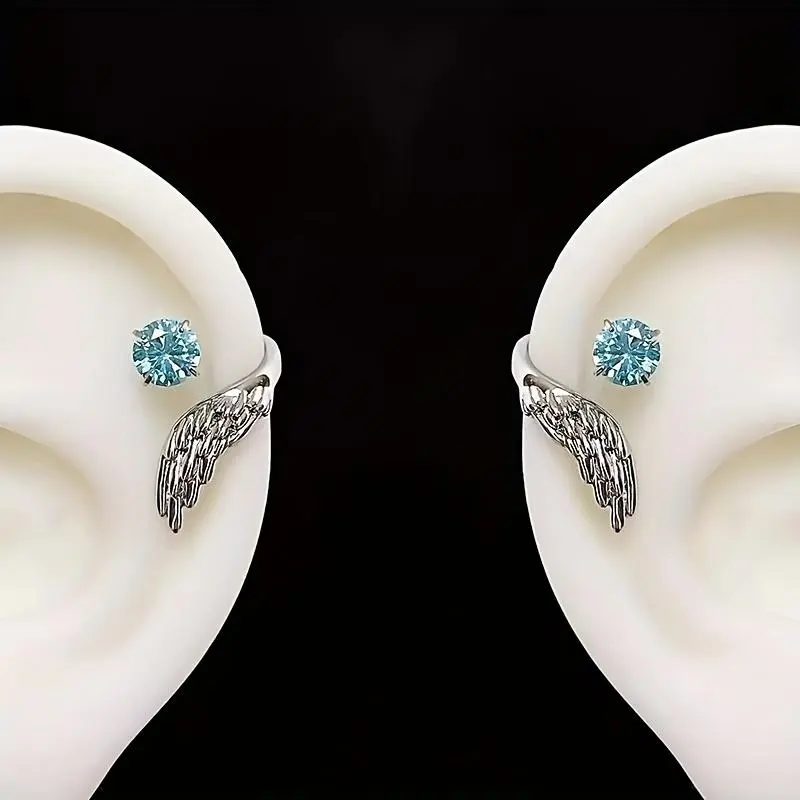 A pair of stunning angel wing ear studs for both men and women, featuring unique angel wings wrapped with synthetic zirconia - perfect for everyday wear, parties, vacations, gifts, and beach outings