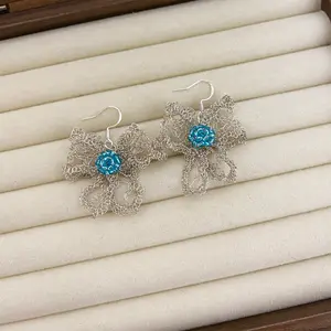Handmade crocheted copper wire bow earrings with a metallic feel and lace bow design, beaded ear jewelry, original design—ideal birthday gift and keepsake; niche, unique handmade jewelry gift
