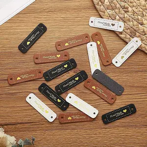 10pcs Handmade PU Leather Tags Handmade with Love PU Labels Faux Leather Sew On Labels Embellishment Knit Accessories with Holes for DIY Crafts Sewing Crochet Knitting Hats (Brown, Black, White)