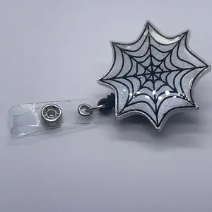 White spider wed badge reel