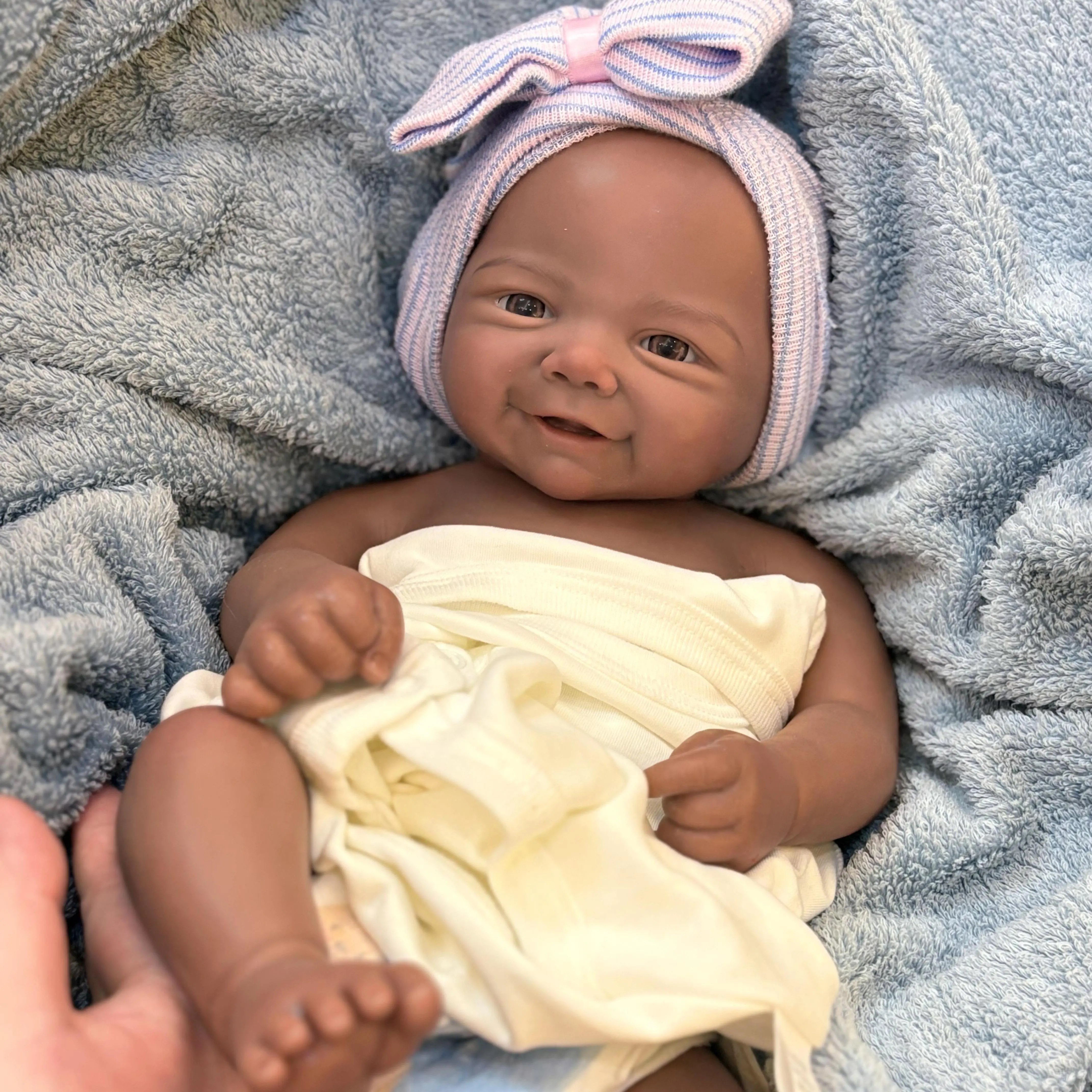 18-inch Soft Silicone Newborn Baby Doll,   Lifelike Brown SkinDoll with Happy Smile, Realistic Details, Soft Body, Bottle,Birth Certificate & Comfort Item, Ideal for Collectors &Birthday Gifts, Lifelike Newborn Doll