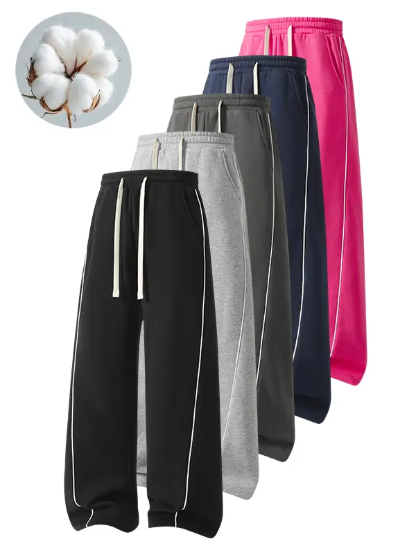 Jogger sweatpants with contrasting side stripes, high elasticity, elastic drawstring waist, loose fit that flatters the figure, suitable for both men and women, long pants for everyday sports.