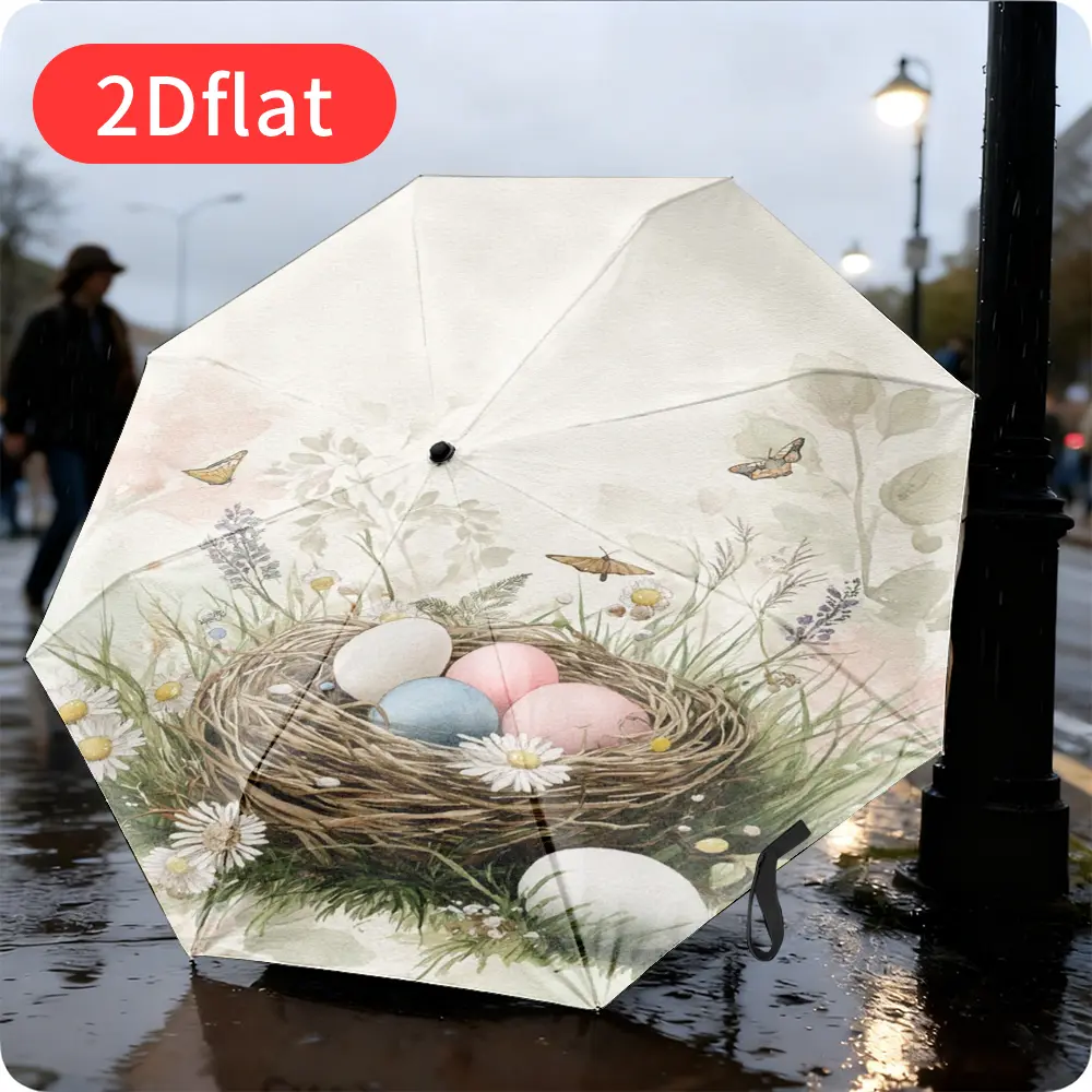 An Easter-themed folding umbrella featuring a delicate watercolor-style nest design with four colorful eggs nestled among blooming flowers. Lightweight and portable, it boasts a durable canopy made of sturdy plastic and